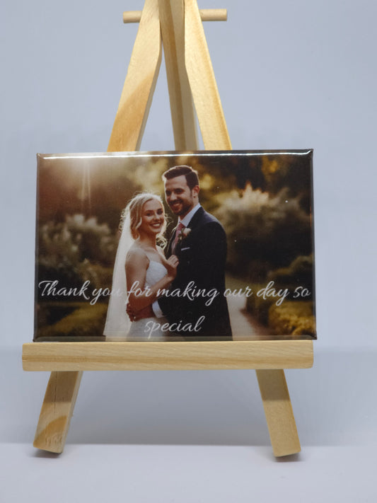 Wooden photo frame with a couple on the cover against a light gray background