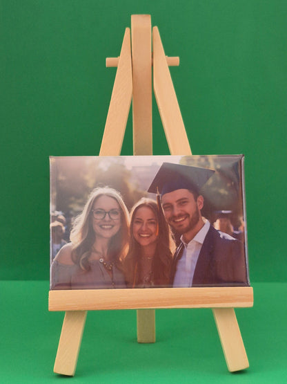 magnet on green background showing graduation photograph