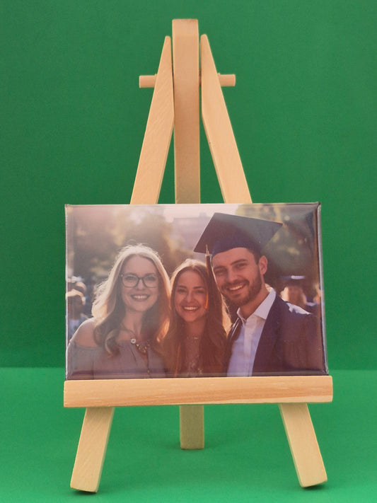 magnet on green background showing graduation photograph