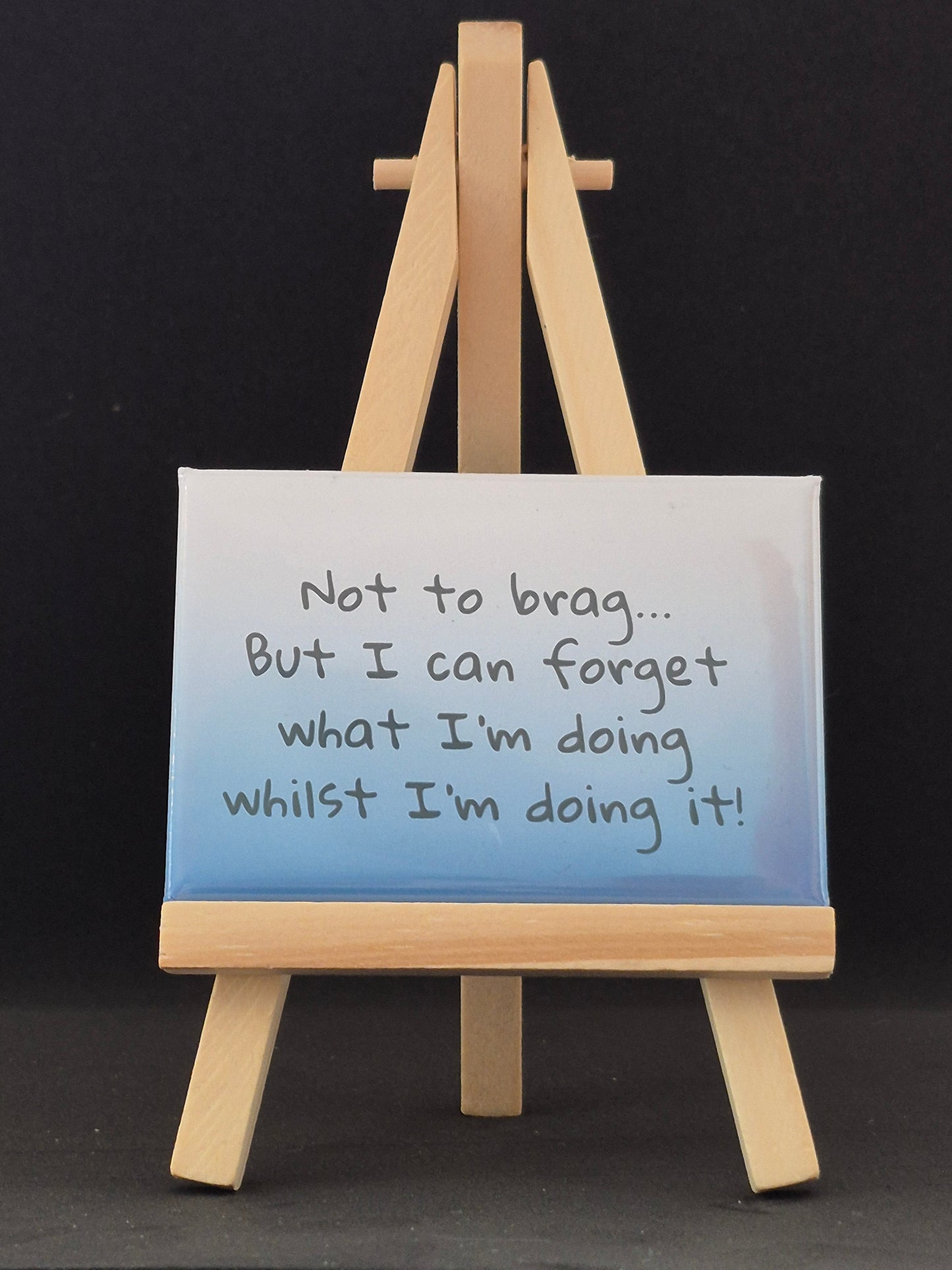 Small easel with a magnet on a black background